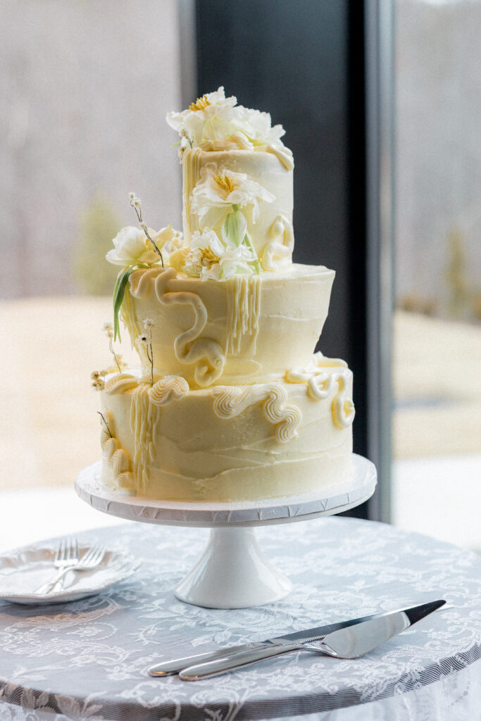 avante garde fashion forward wedding editorial at the sky room in north carolina featuring an abstract tiered cake design
