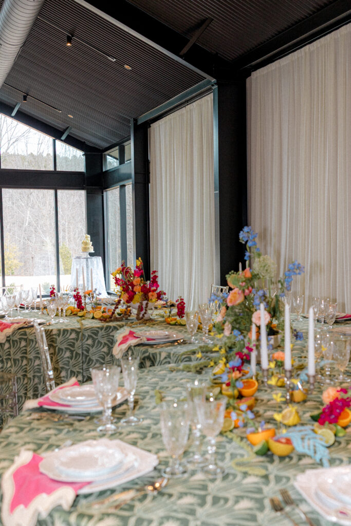 design forward colorful wedding tablescape using abstract prints and fruit floral styling at the sky room in north carolina